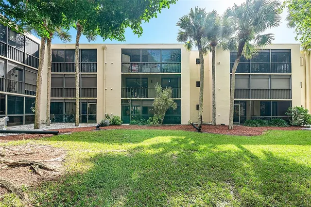 a huge green field with lots of trees