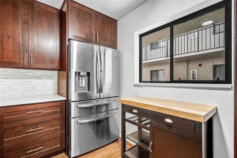 a kitchen with stainless steel appliances granite countertop a sink stove and microwave