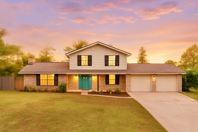 a front view of a house with yard