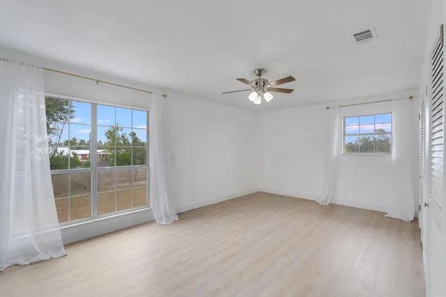 a view of an empty room with a bathroom