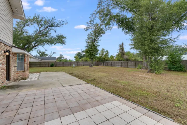a backyard of a house with lots of green space