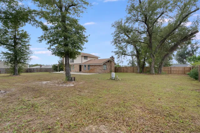 a view of a field with an trees