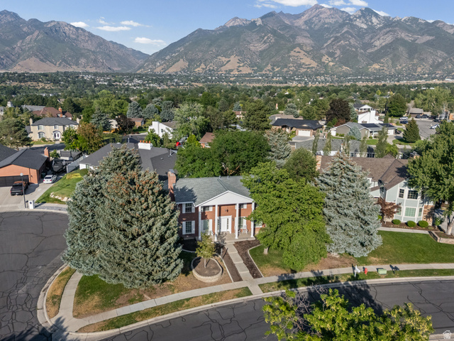8441 Rua Branco Drive Sandy, UT 84093 - Photo 44 of 47 Elegant brick Colonial residence situated on a tree-lined lot with mature evergreen landscaping and circular driveway