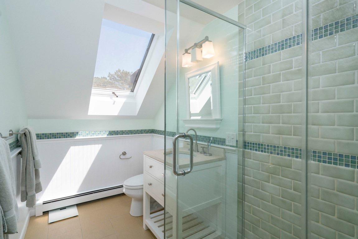 334 Cove Road Wellfleet, MA 02667 - Photo 23 of 32 a bathroom with a shower and a toilet