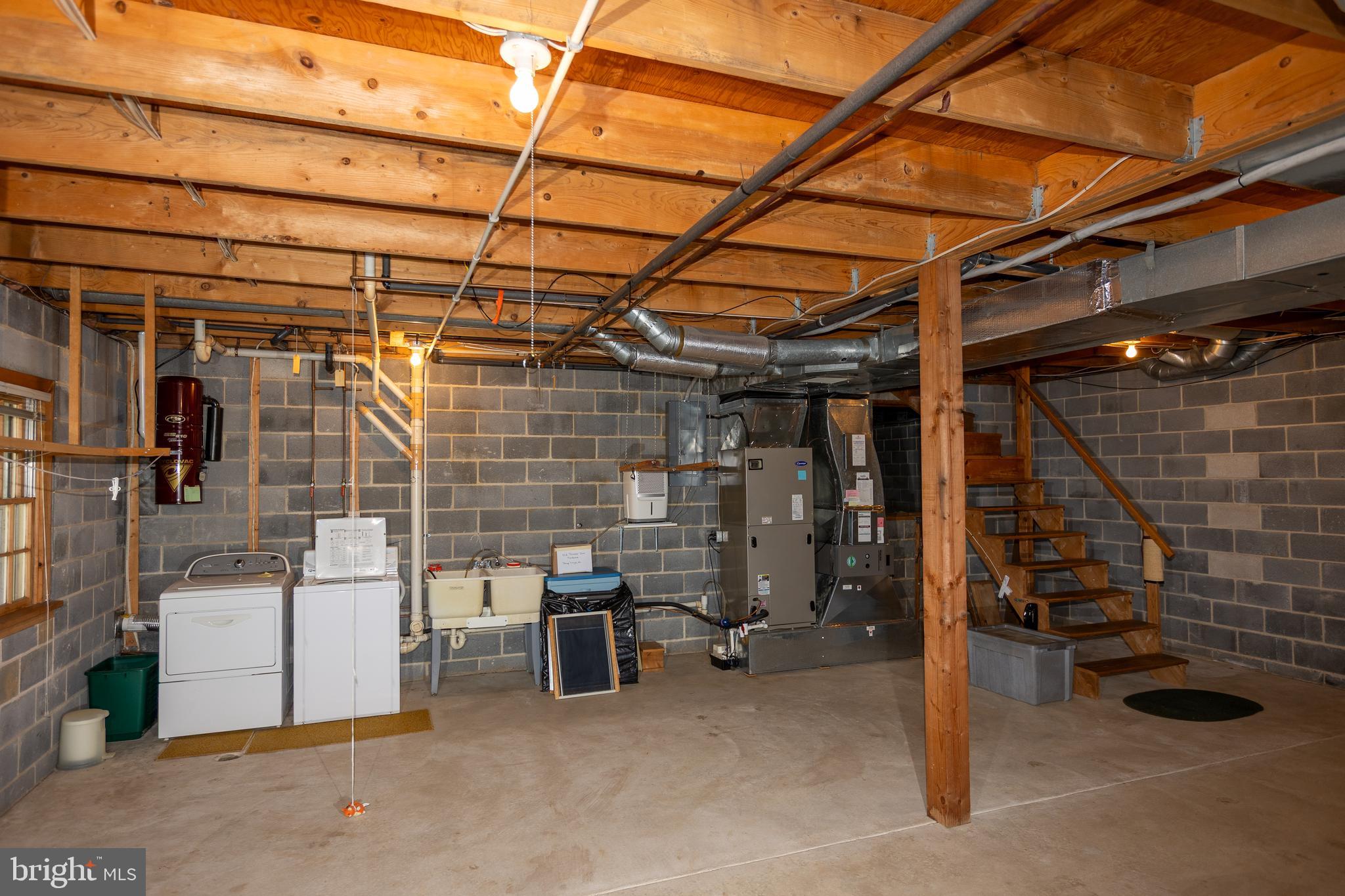 1420 Street Road Chester Springs, PA 19425 - Photo 35 of 46 Basement Acess to Crawlspace Behind Stairs