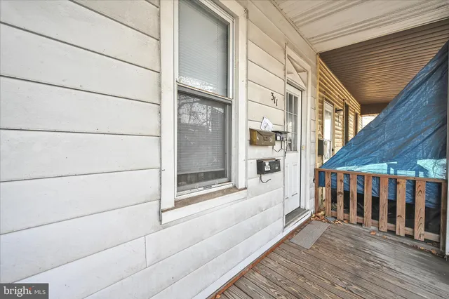 a view of a balcony with wooden floor