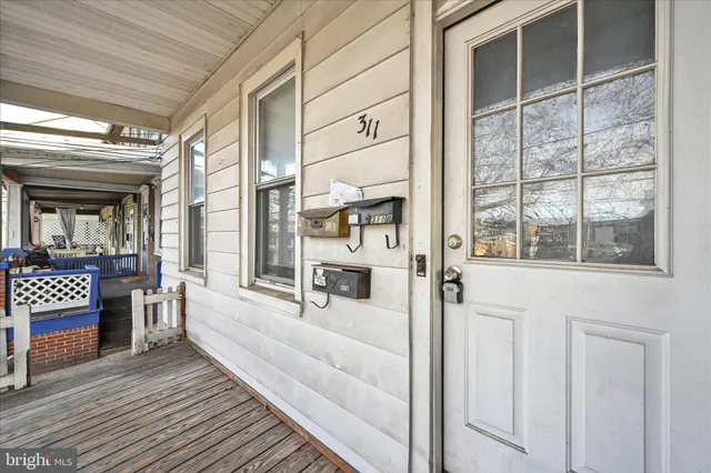 a view of a porch with a bench
