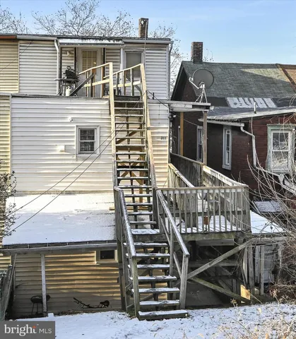 a view of a house with a door and balcony