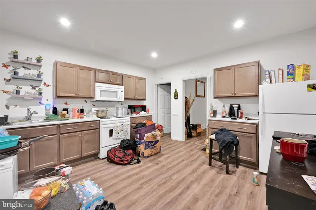 a kitchen that has a sink and a stove in it