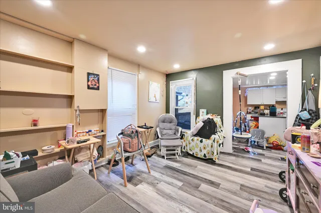 a living room with lots of furniture and gym equipment
