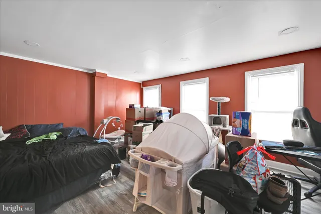 a living room with furniture a window and a lamp