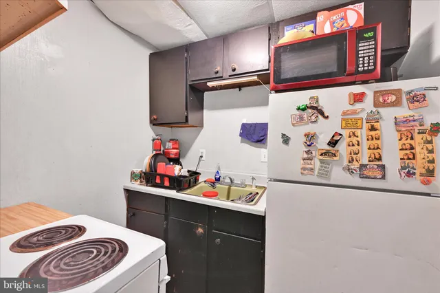 a bedroom with a bed and a desk