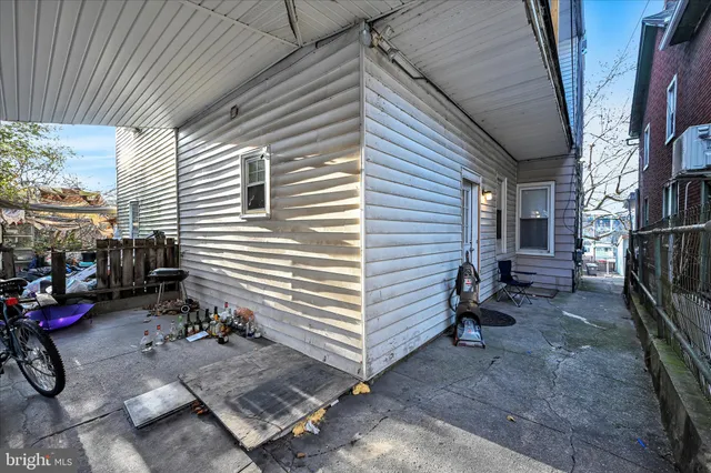 a view of a patio with table and chairs and ice snow