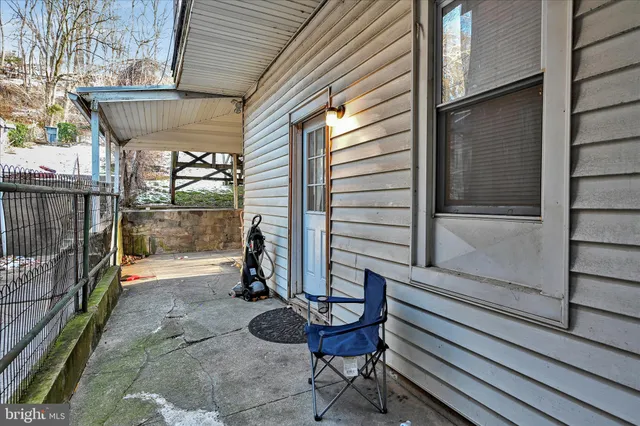 a view of a porch with furniture