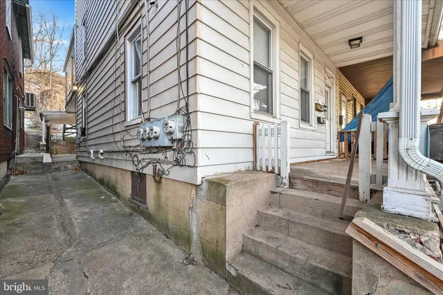 a view of a balcony with outdoor kitchen