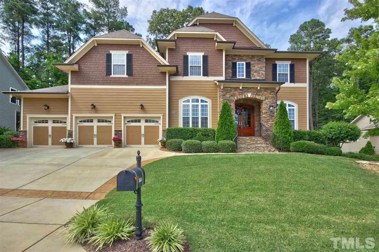 8604 Stonechase Drive Raleigh, NC 27613 - Photo 1 of 25 a front view of a house with a yard