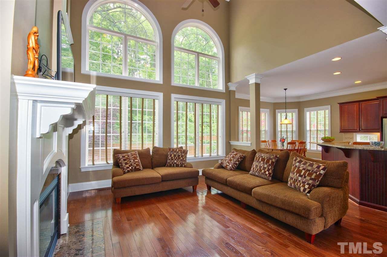 8604 Stonechase Drive Raleigh, NC 27613 - Photo 12 of 25 a living room with furniture and a fireplace