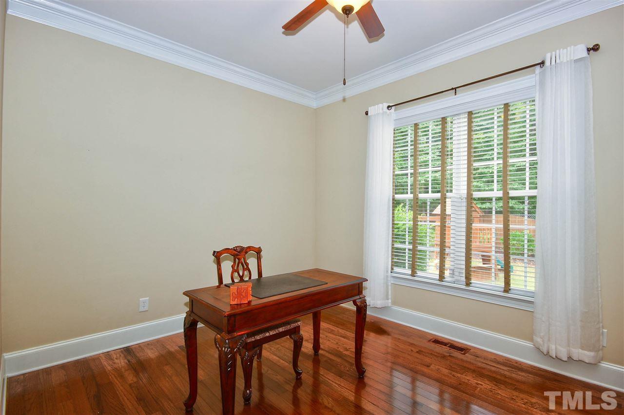 8604 Stonechase Drive Raleigh, NC 27613 - Photo 13 of 25 a view of a workspace with furniture and a window