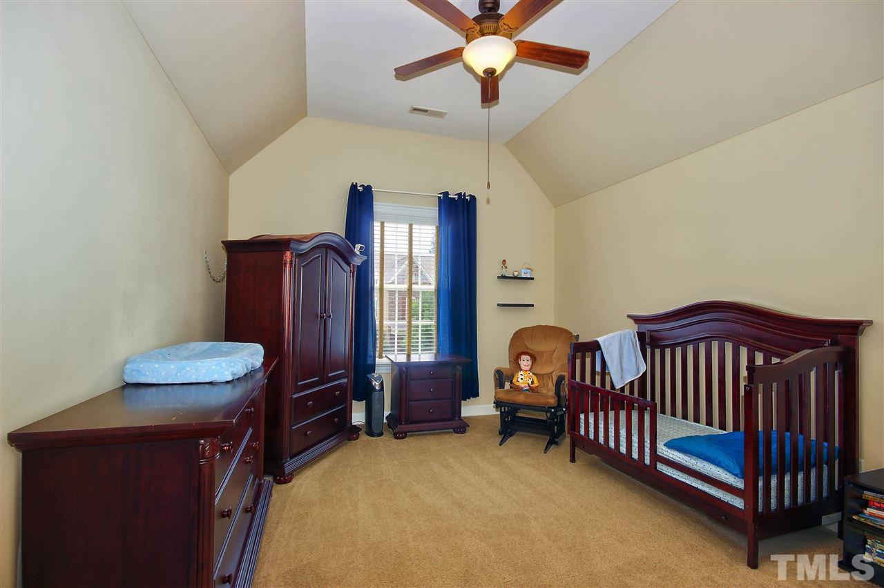 8604 Stonechase Drive Raleigh, NC 27613 - Photo 21 of 25 a bedroom with furniture and a window