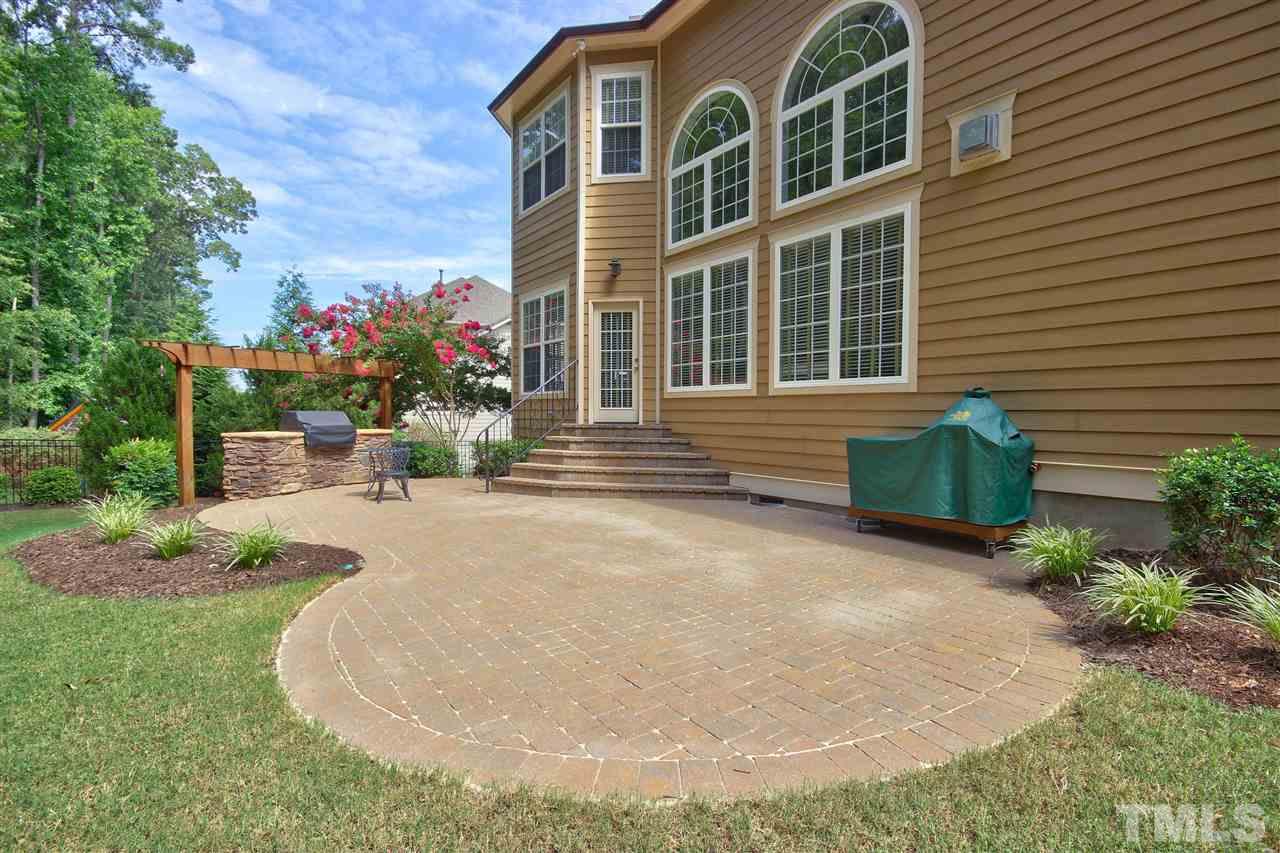 8604 Stonechase Drive Raleigh, NC 27613 - Photo 24 of 25 a front view of a house with a yard