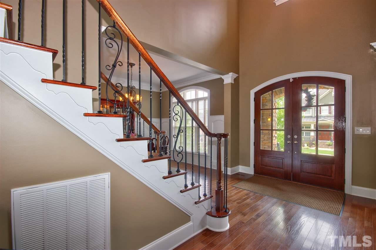 8604 Stonechase Drive Raleigh, NC 27613 - Photo 3 of 25 a view of an entryway with wooden floor and door