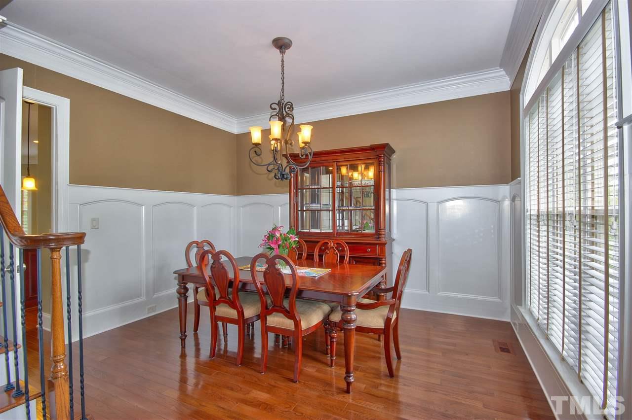 8604 Stonechase Drive Raleigh, NC 27613 - Photo 5 of 25 a view of a dining room with furniture window and wooden floor