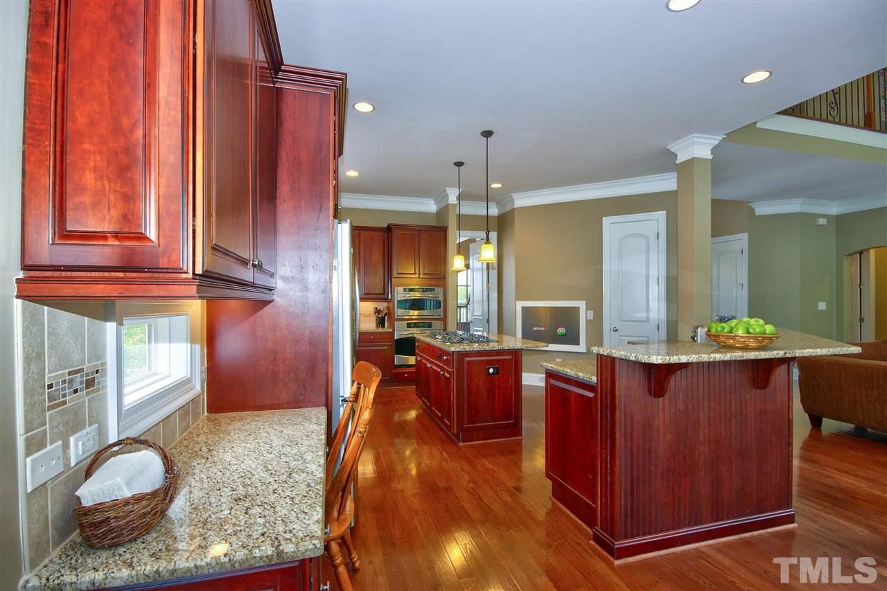 8604 Stonechase Drive Raleigh, NC 27613 - Photo 8 of 25 a view of living room with granite countertop furniture and wooden floor