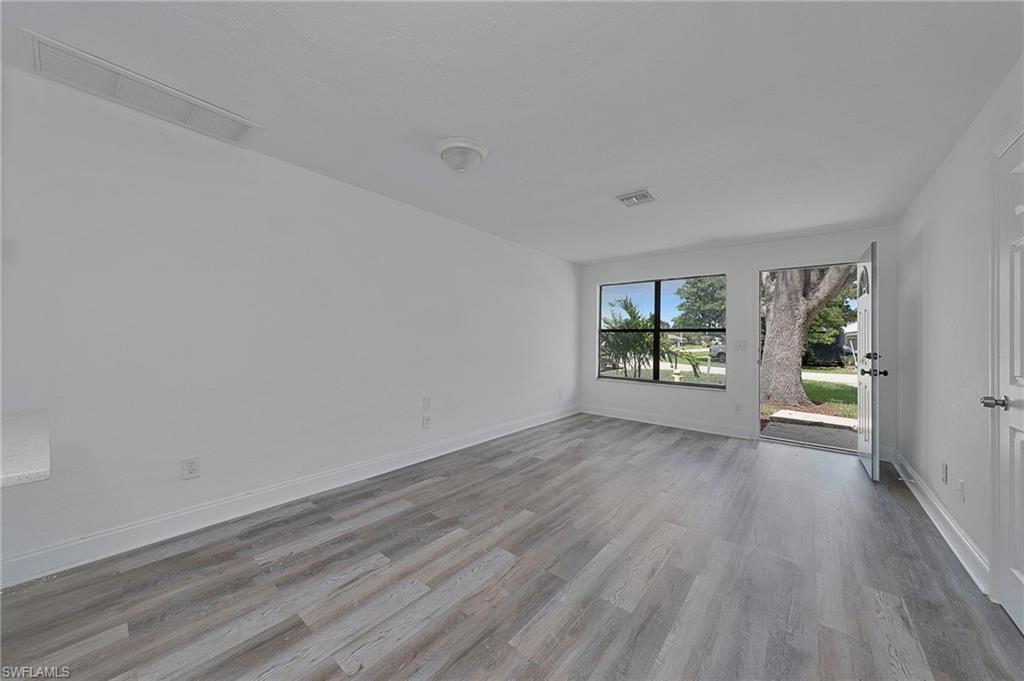 19133 Tangerine Road Fort Myers, FL 33967 - Photo 10 of 17 Unfurnished room with hardwood / wood-style floors