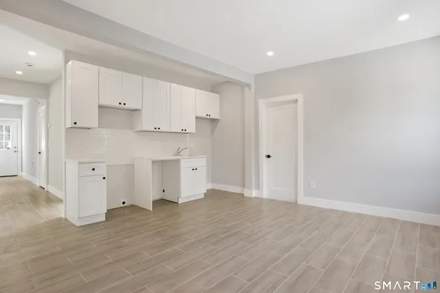 a view of kitchen with wooden floor