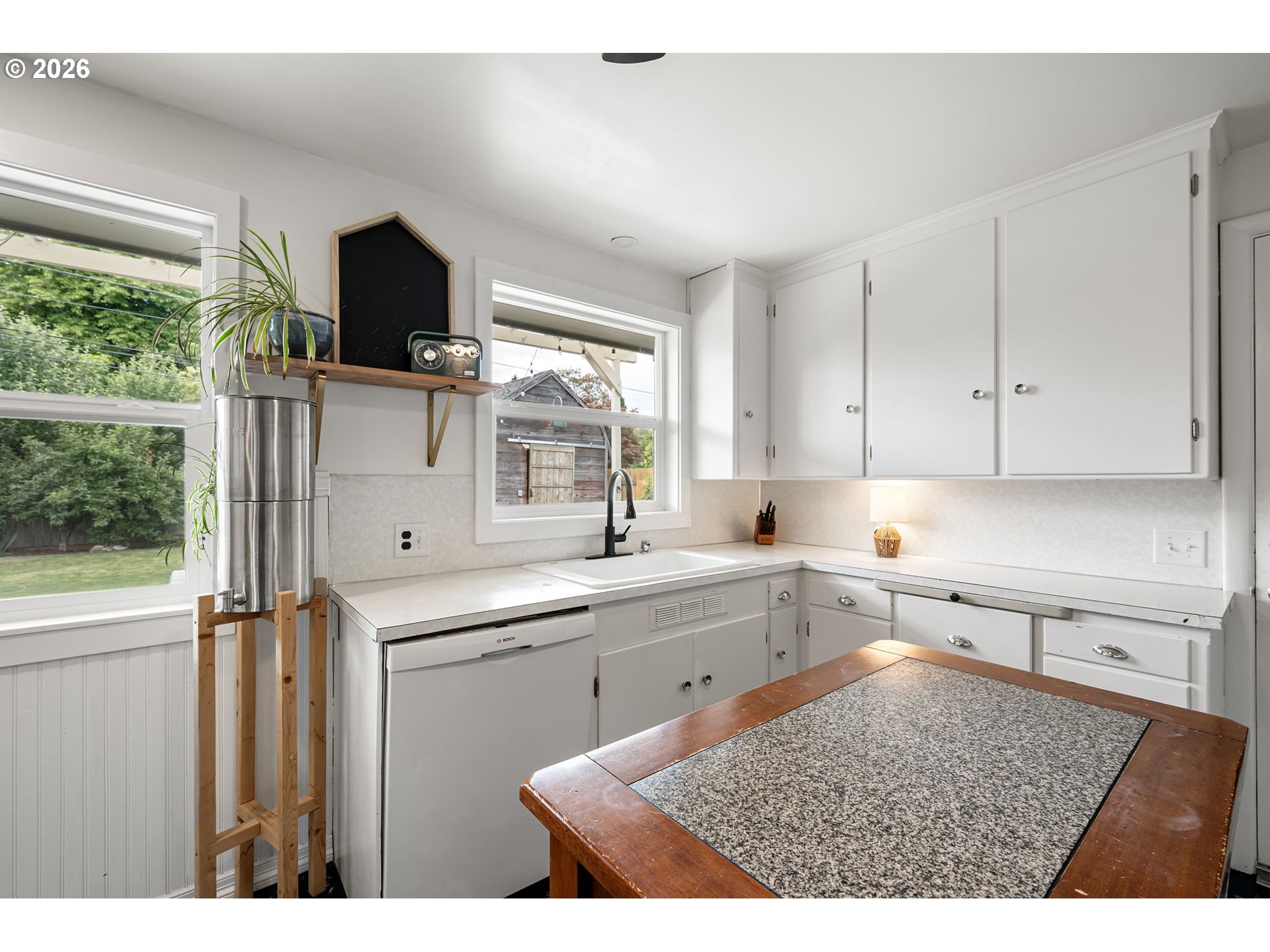 765 Louis Street Eugene, OR 97402 - Photo 14 of 45 a kitchen with a sink cabinets and window