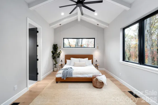 a bedroom with a bed and window