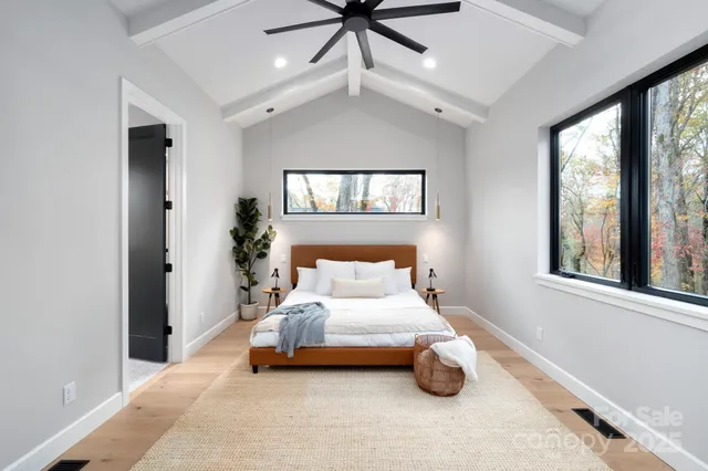 a bedroom with a bed and window