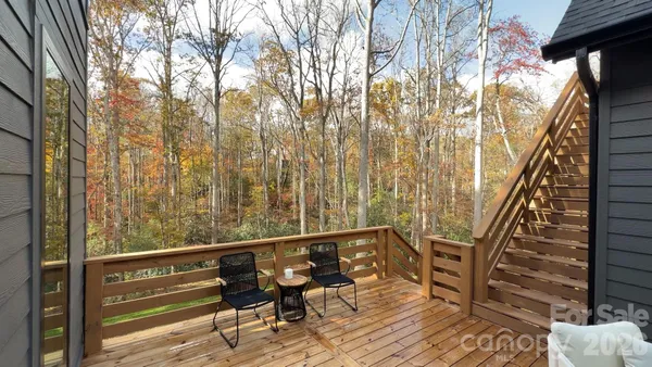 a view of balcony with wooden floor and bench
