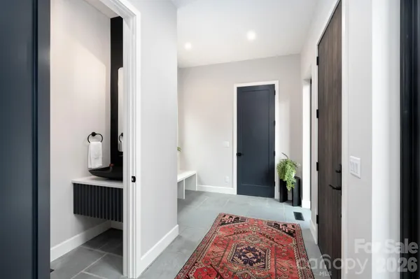 a view of bedroom with wooden floor
