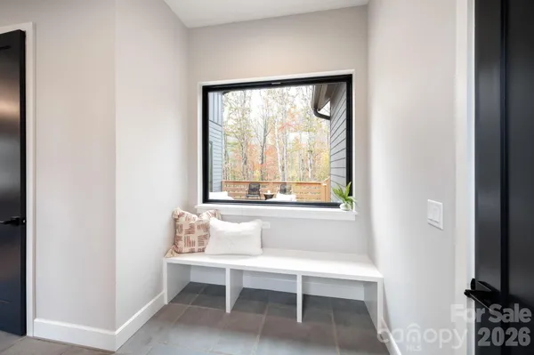 a living room with a window and a table