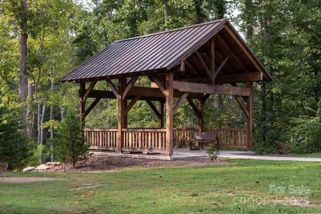 a view of a chair and table in the garden