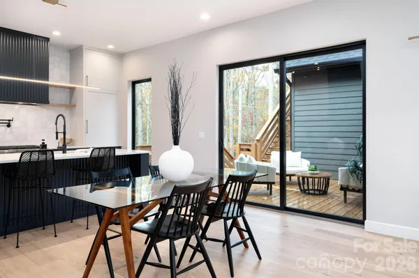 a view of a dining room with furniture and window