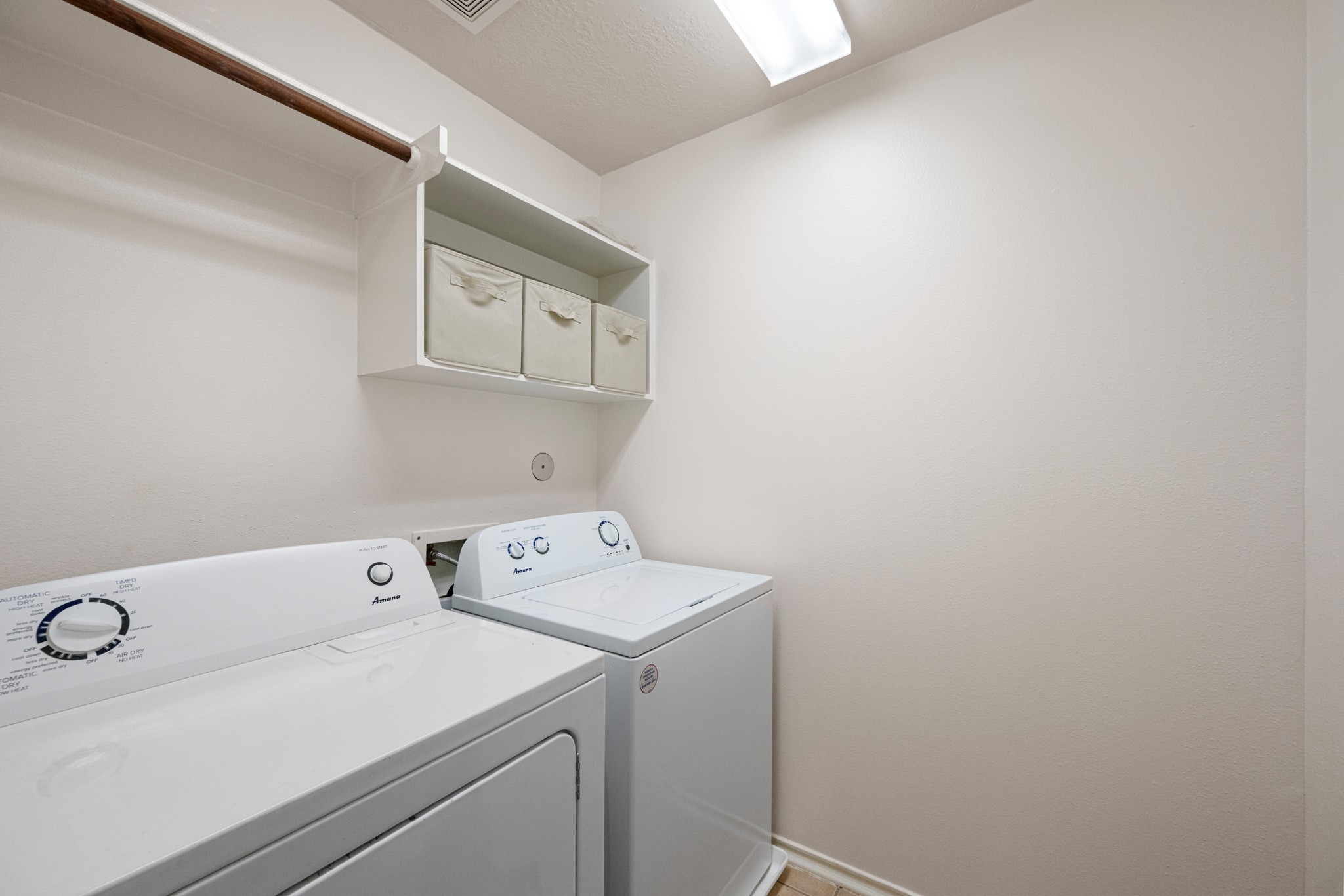 11938 Ramla Place Trail Houston, TX 77089 - Photo 22 of 28 Experience effortless convenience with this second-floor utility area, featuring appliances and ample storage for streamlined living.