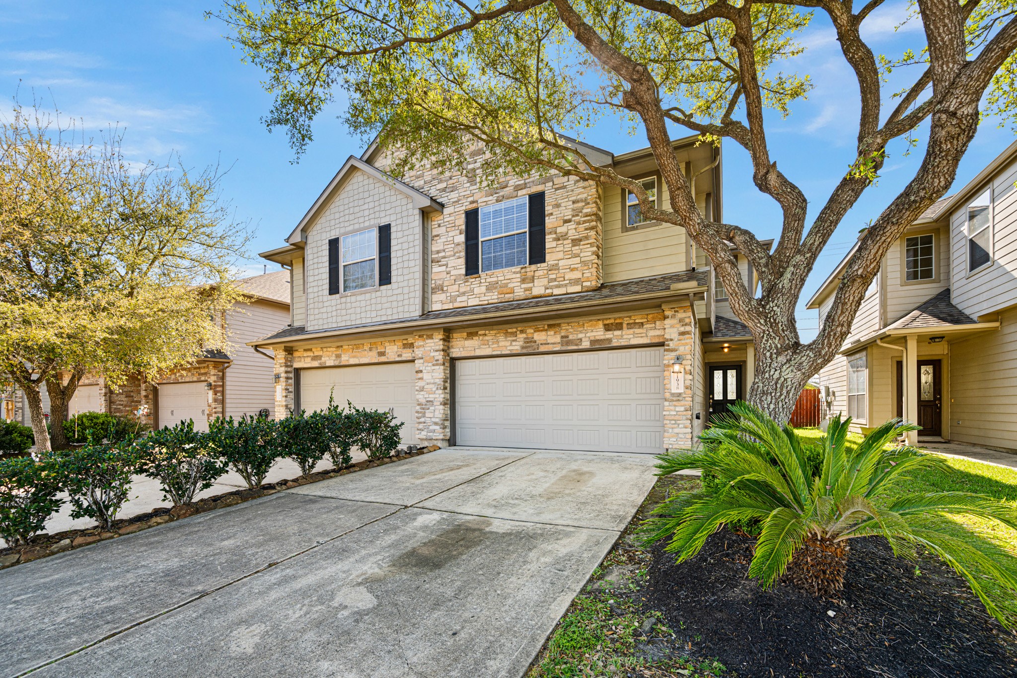 11938 Ramla Place Trail Houston, TX 77089 - Photo 3 of 28 This stunning two-story home features a charming stone façade, a spacious three-car garage, and lush landscaping that welcomes you with elegance and style.