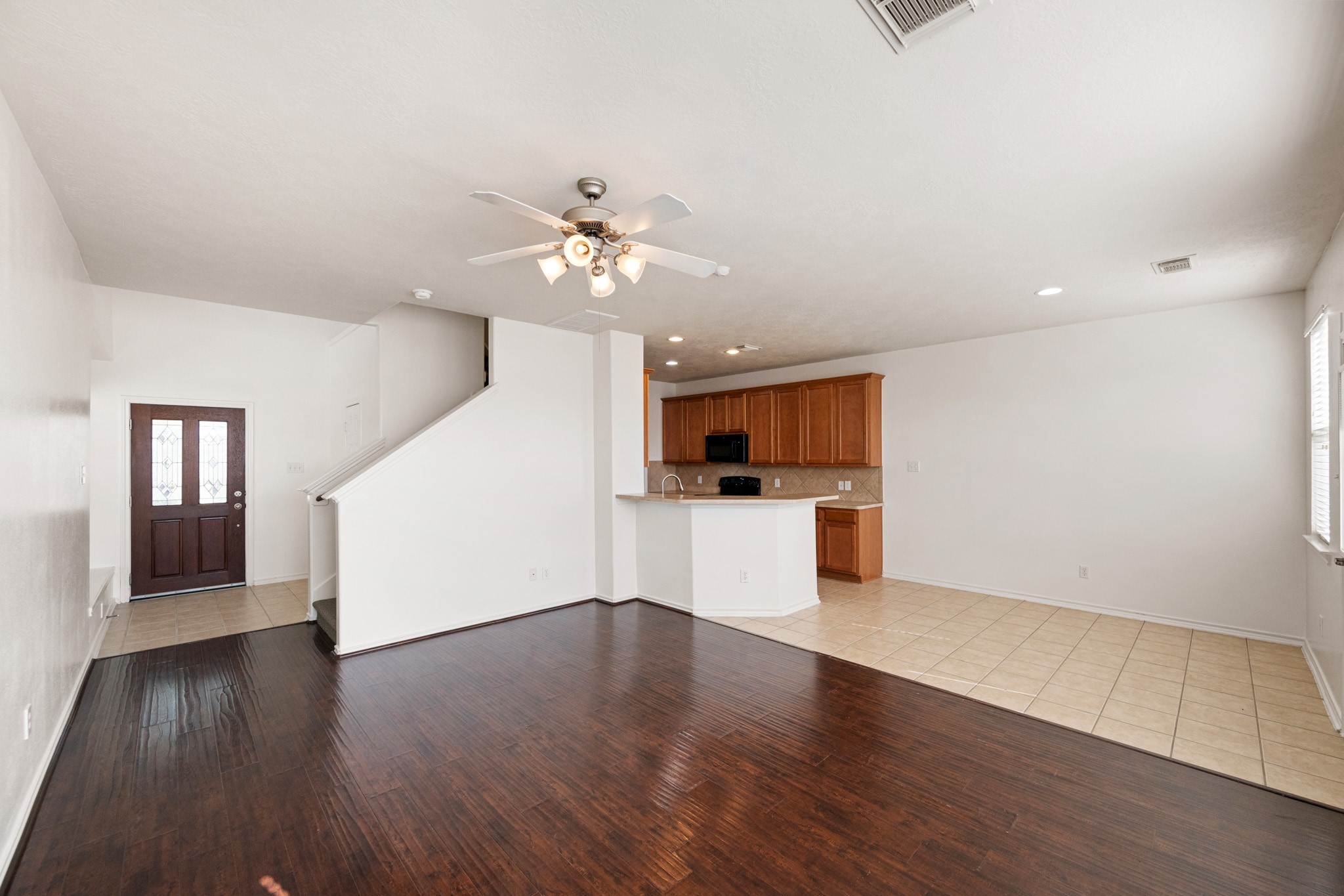 11938 Ramla Place Trail Houston, TX 77089 - Photo 6 of 28 This inviting open-concept living space seamlessly flows into a cozy breakfast area, perfect for both relaxation and entertaining.