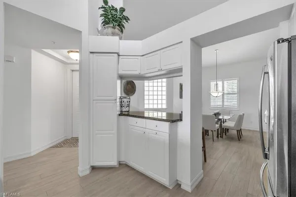 a view of a kitchen from the hallway