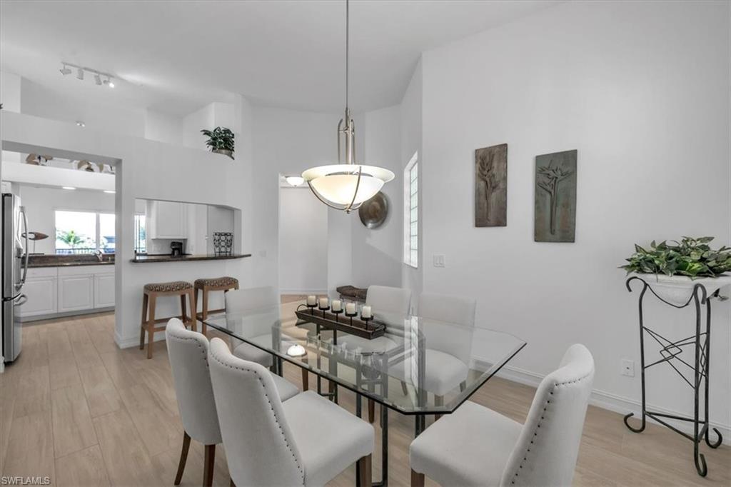 Undisclosed Address Naples, FL 34108 - Photo 18 of 44 a dining room with furniture and window