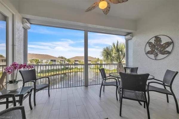 a dining room with furniture window and outside view