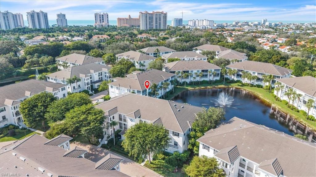 Undisclosed Address Naples, FL 34108 - Photo 27 of 44 an aerial view of a city with lake view