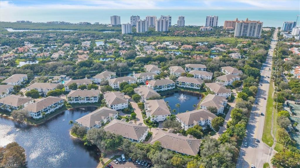 Undisclosed Address Naples, FL 34108 - Photo 28 of 44 an aerial view of a city with lots of residential buildings