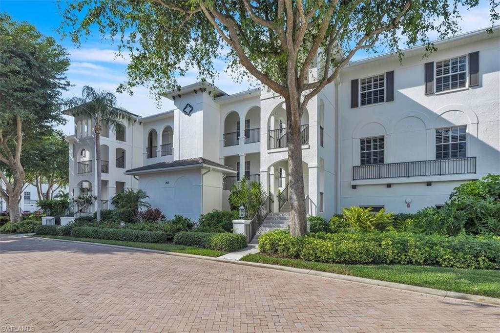 Undisclosed Address Naples, FL 34108 - Photo 40 of 44 a front view of a house with garden