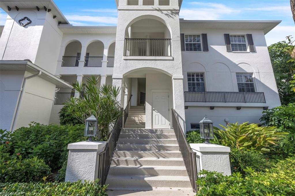 Undisclosed Address Naples, FL 34108 - Photo 41 of 44 a front view of a house with garden
