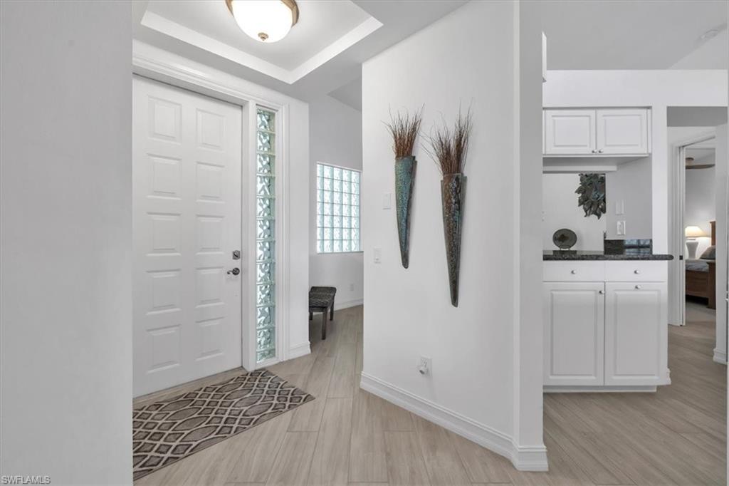 Undisclosed Address Naples, FL 34108 - Photo 44 of 44 a walk in closet with wooden floor