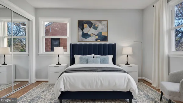 a bedroom with a large bed and a flat screen television