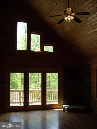 174 Mosby Springs Road Linden, VA 22642 - Photo 27 of 30 Living room opens out onto one of 2 levels of deck